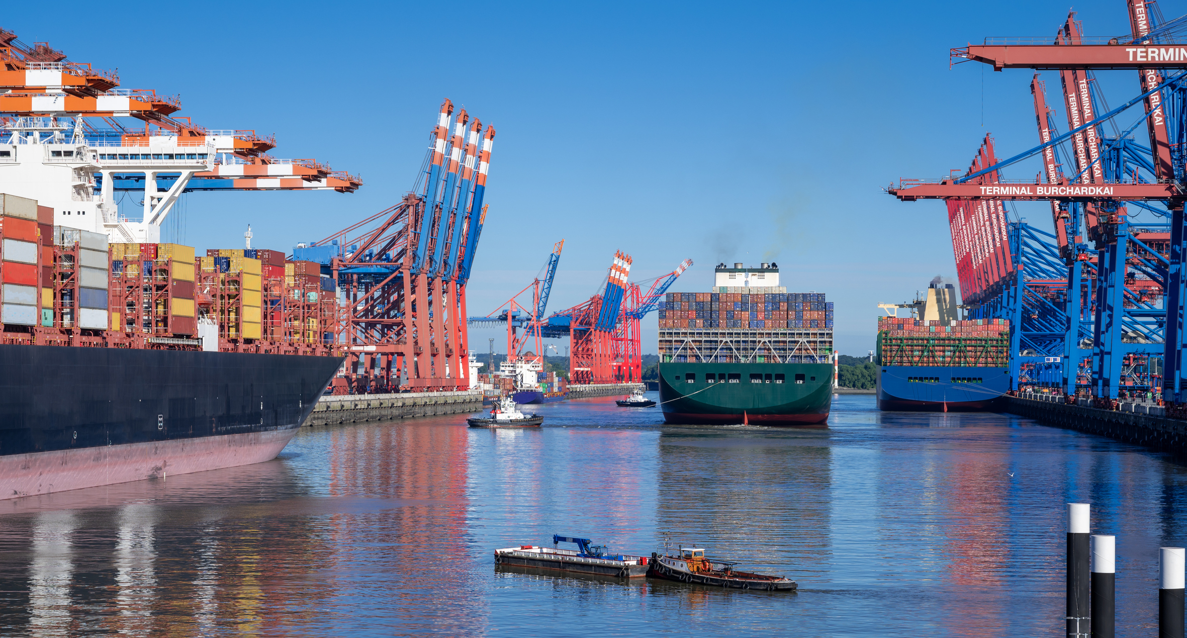 Three ships in a port in Hamburg, Germany